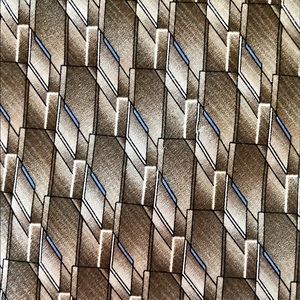 Luxury 90's NWOT silk tie Geometric print Brown and blue and white background